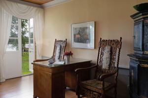 a home office with a desk and a chair at Saxå Bruk in Filipstad