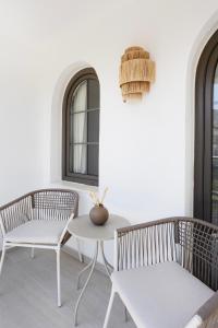a living room with two chairs and a table at Casa Dalida Boutique Hotel in Datca
