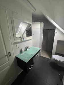 Postel nebo postele na pokoji v ubytování Ferienwohnung Lüttje Huuske