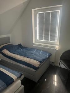 Postel nebo postele na pokoji v ubytování Ferienwohnung Lüttje Huuske