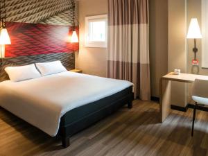 Postel nebo postele na pokoji v ubytování ibis Bourg en Bresse