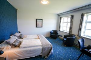 Postel nebo postele na pokoji v ubytování Hotel Søparken