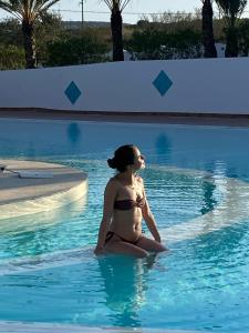 Bazén v ubytování Le Rocce Antiche Hotel Resort nebo v jeho okolí