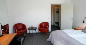 Postel nebo postele na pokoji v ubytování Hotel Søparken