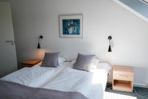 Postel nebo postele na pokoji v ubytování Hotel Søparken