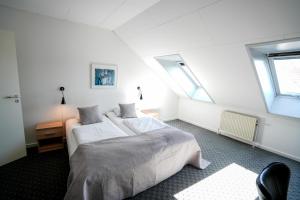 Postel nebo postele na pokoji v ubytování Hotel Søparken + 36 fotografií