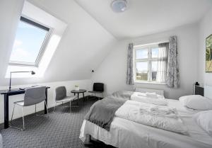 Postel nebo postele na pokoji v ubytování Hotel Søparken