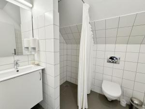 Koupelna v ubytování Hotel Søparken