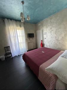 Postel nebo postele na pokoji v ubytování Le Dimore di Mariuccia Relax & SPA