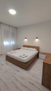 Ένα ή περισσότερα κρεβάτια σε δωμάτιο στο Casa di Ca' Balbi