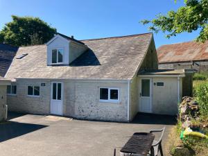a house with a garage and a roof at Sleeping Giant outdoor adventure flat in Pen-y-cae