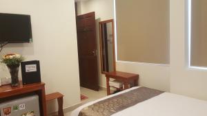 Postel nebo postele na pokoji v ubytování Hotel Phạm Duy