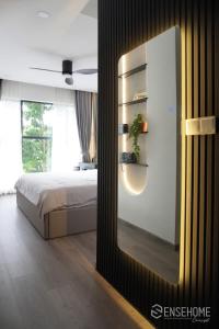 a bedroom with a bed and a large mirror at Nhà của Hải - Apartment Luxury Diamond Brilliant in Ho Chi Minh City