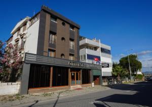 a building on the side of a street at Otel Ege Akcay in Akcay
