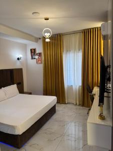 Postel nebo postele na pokoji v ubytování Cozy Studio in GRA - Portharcourt