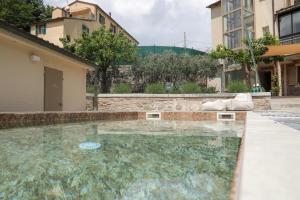 a swimming pool in the middle of a building at Riva Quartarola in Modigliana