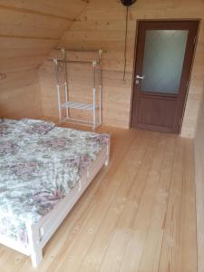 Postel nebo postele na pokoji v ubytování Sadyba u Vani