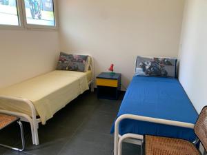 A bed or beds in a room at Rental rooms Antonella