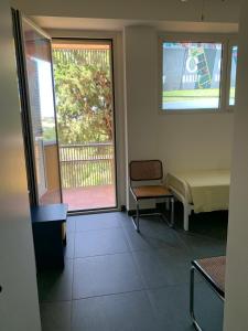 A television and/or entertainment centre at Rental rooms Antonella