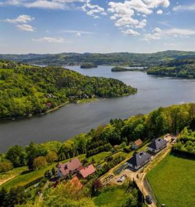 an aerial view of a house and a river at Dom Tabaszowa 182 - Jezioro Rożnowskie in Tabaszowa