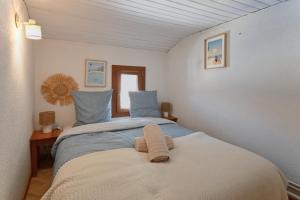 Ένα ή περισσότερα κρεβάτια σε δωμάτιο στο La Mouvette - 10min de le Plage +7 φωτογραφίες