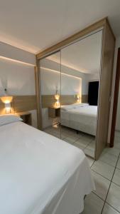 Postel nebo postele na pokoji v ubytování Ap Ponta Negra + 10 fotografií