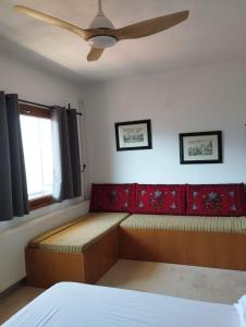 Postel nebo postele na pokoji v ubytování Το σπίτι της πλατείας