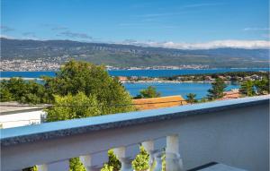 a balcony with a view of a city and water at Nice Apartment In Silo With Wifi in Šilo