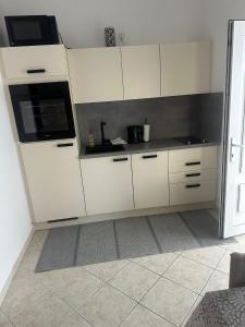 Kuchyň nebo kuchyňský kout v ubytování Apartments Vinea