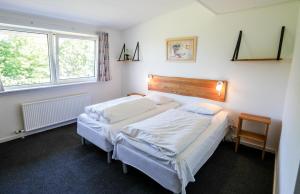 Postel nebo postele na pokoji v ubytování Hotel Vissenbjerg Storkro