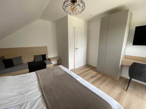Łóżko lub łóżka w pokoju w obiekcie Seaways Apartments
