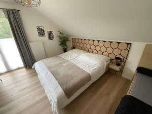 Łóżko lub łóżka w pokoju w obiekcie Seaways Apartments