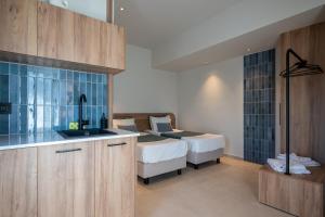 Posteľ alebo postele v izbe v ubytovaní Psaras Apartments