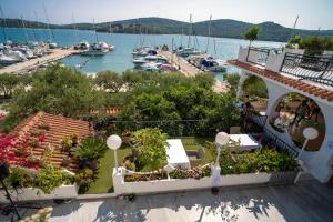 a view of a marina from the balcony of a resort at Irene Bed & Breakfast Tisno in Tisno