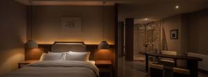 Letto o letti in una camera di Chengdu Flowing Strings peninsula boutique hotel-Near the Sichuan Cuisine Museum