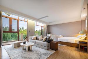 Letto o letti in una camera di Chengdu Flowing Strings peninsula boutique hotel-Near the Sichuan Cuisine Museum
