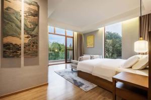 Letto o letti in una camera di Chengdu Flowing Strings peninsula boutique hotel-Near the Sichuan Cuisine Museum