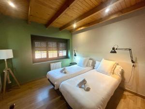 Posteľ alebo postele v izbe v ubytovaní Casa Bolboreta by Unusual Hotels