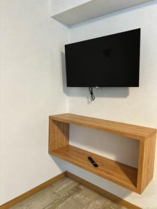 Televízia a/alebo spoločenská miestnosť v ubytovaní Residence Raethia tra Bormio e Livigno