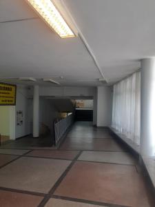 an empty hallway of a building with a stair case at Moniuszki 4 in Cieszyn