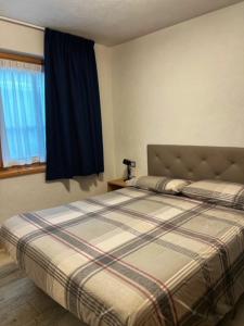 Posteľ alebo postele v izbe v ubytovaní Residence Raethia tra Bormio e Livigno