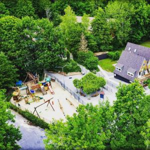 an overhead view of a park with a playground at Hidden jewel in Durbuy's forest in Durbuy
