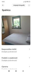 a bedroom with a bed and a window at Lovely 1- bedroom apartment in Skofja Loka in Škofja Loka