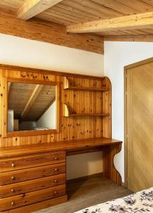 Posteľ alebo postele v izbe v ubytovaní Residence Raethia tra Bormio e Livigno