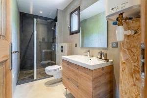 a bathroom with a sink and a toilet and a shower at Bergeries Saumane, Petite Bergerie in Saumane-de-Vaucluse +17 photos