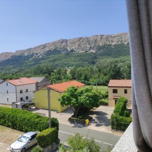 a view from a window of a town with a mountain at Lovrić Studio mit Balkon in Jurandvor +10 photos