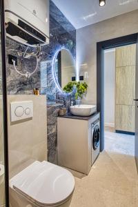 a bathroom with a sink toilet and a mirror at La Dolce Villa 1 in Dubrovnik +52 photos