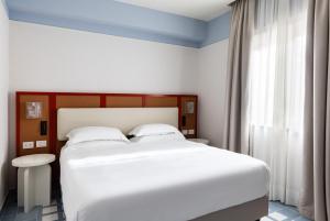 Hotel Plaza客房内的一张或多张床位