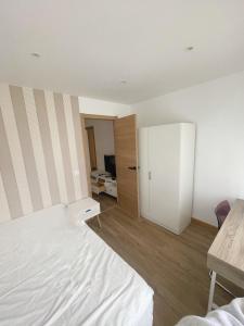 Ένα ή περισσότερα κρεβάτια σε δωμάτιο στο Precioso apartamento luminoso con terraza