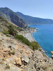 a view of a beach on a rocky shore at Hotel Agia Roumeli by the SEA in Agia Roumeli +21 photos
